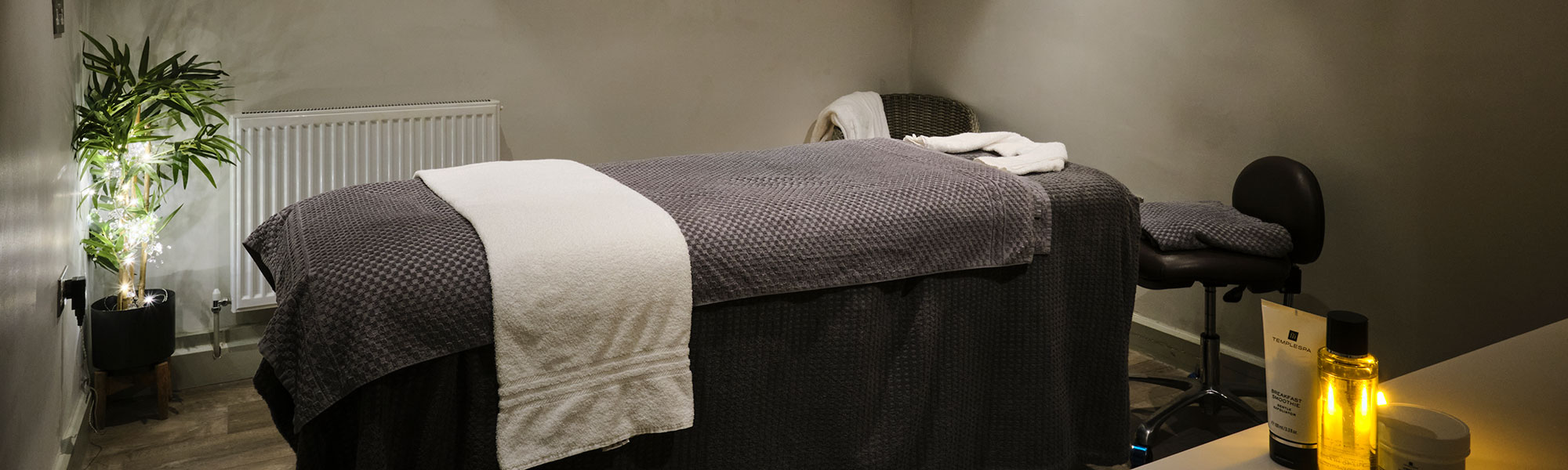 bed set up for a massage in a treatment room in the Spa in the Garden