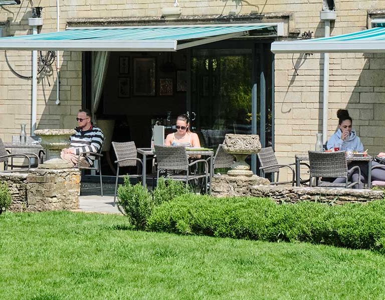 People sat on the terrace outside the garden restaurant