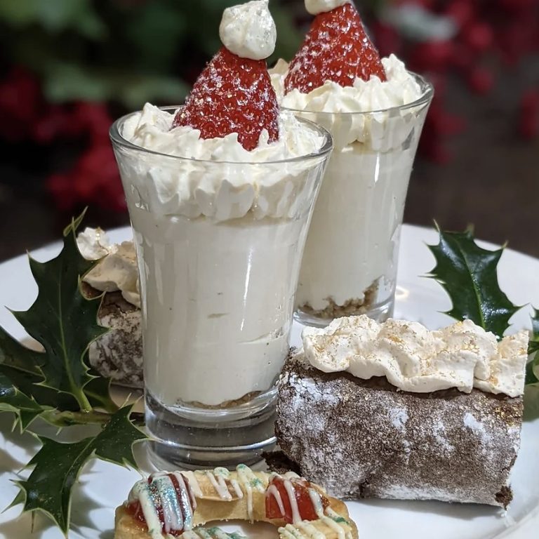 Festive afternoon tea with the desserts with strawberries on top to look like a Santa hat