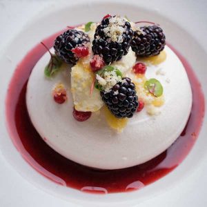 Blackcurrant and pistachio pavlova in the garden restaurant