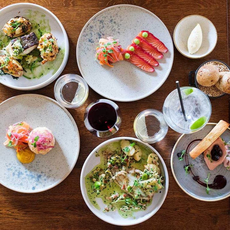 A selection of Dinner menu dishes on a table in the Garden Restaurant