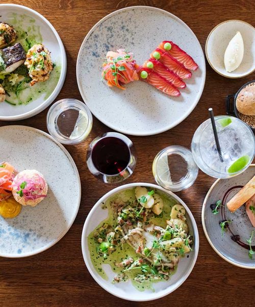 A selection of Dinner menu dishes on a table in the Garden Restaurant